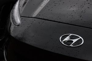 Hyundai badge on vehicle hood -  Compare the Hyundai vs. Honda concept image